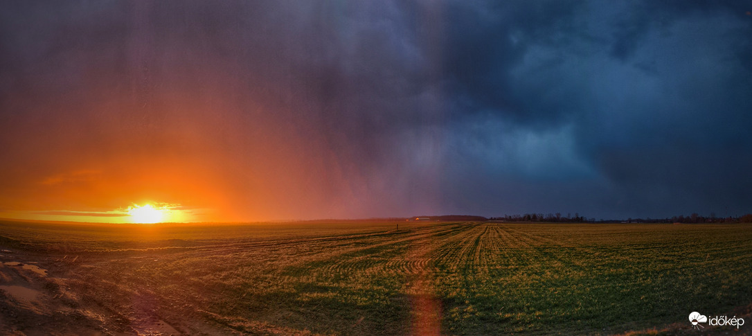 Hózápor naplementi érkezése panorámába foglalva